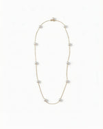 Convertible 18K gold pearl necklace featuring perfectly round ocean pearls and gold clasp for versatile styling