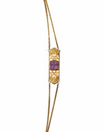 Amethyst bar gold bracelet with intricate carvings and purple-gold design
