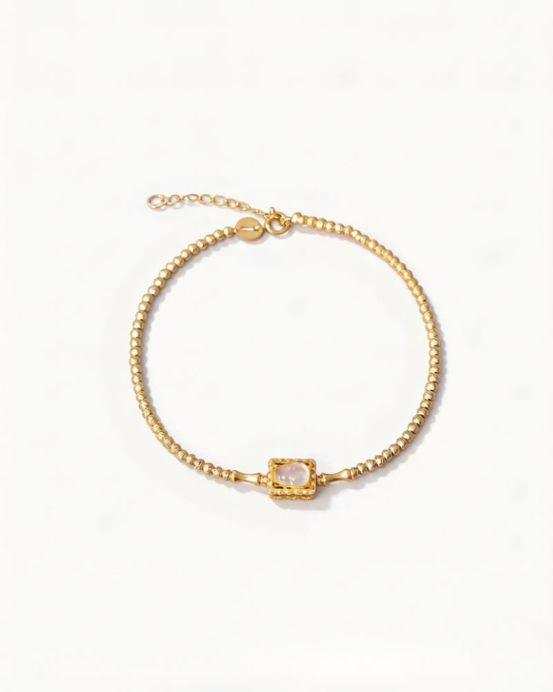 Gold and jade bracelet with an icy jade gourd centre and a diamond halo