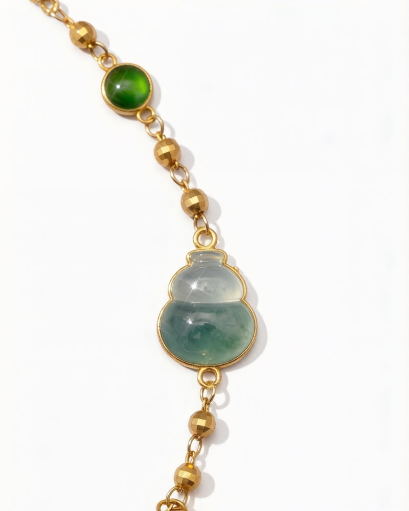 Gold ingot and green jade gourd charm bracelet