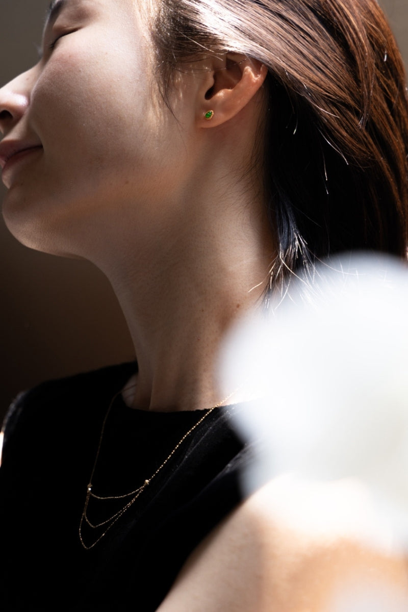 Fine 18K yellow gold chain necklace on a soft background