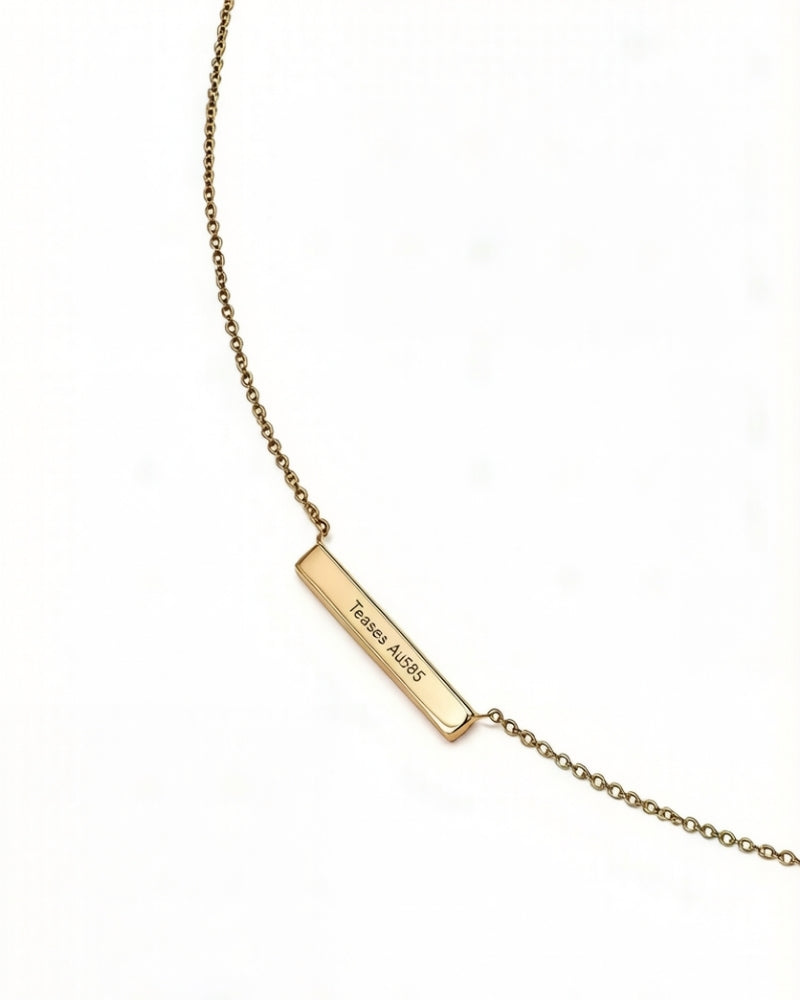 Gold diamond bar necklace set with a row of round diamonds