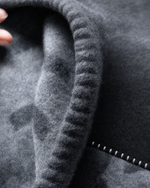 Close-up of hand-stitched rounded edge detail