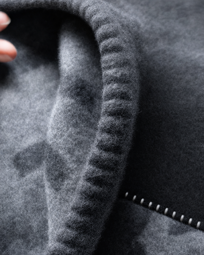 Close-up of hand-stitched rounded edge detail