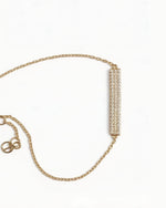 14K gold necklace with 58 clear lab-grown diamonds, wealth and peace amulet design