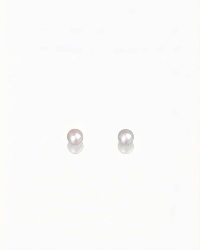 Pink sea pearl drop earrings in 18K gold from private collection with soft glowing pink luster