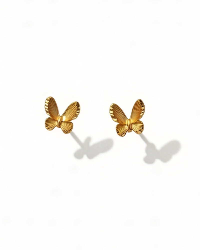 Butterfly sparkling earrings in 18K gold from Free and Elegant Collection, day and night wear, authentic Teases hallmark.