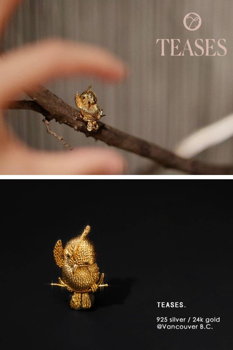 Side angle of handcrafted golden parrot brooch with natural black diamonds